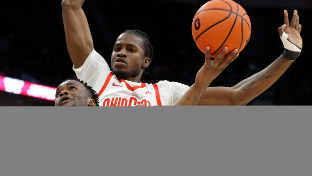 Penn State's Kanye Clary goes to the basket as Ohio State's Felix Okpara defends in a Big Ten men's basketball game at Value City Arena.